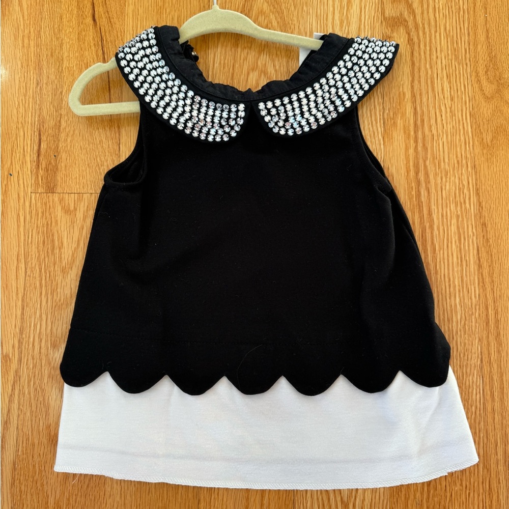 Kate Spade black and white top with gorgeous rhinestone detail! Size 4